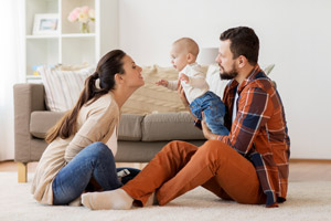 Couple inside of a home with their baby. Apex Air, serving Vancouver WA talks about how to test your indoor air quality.
